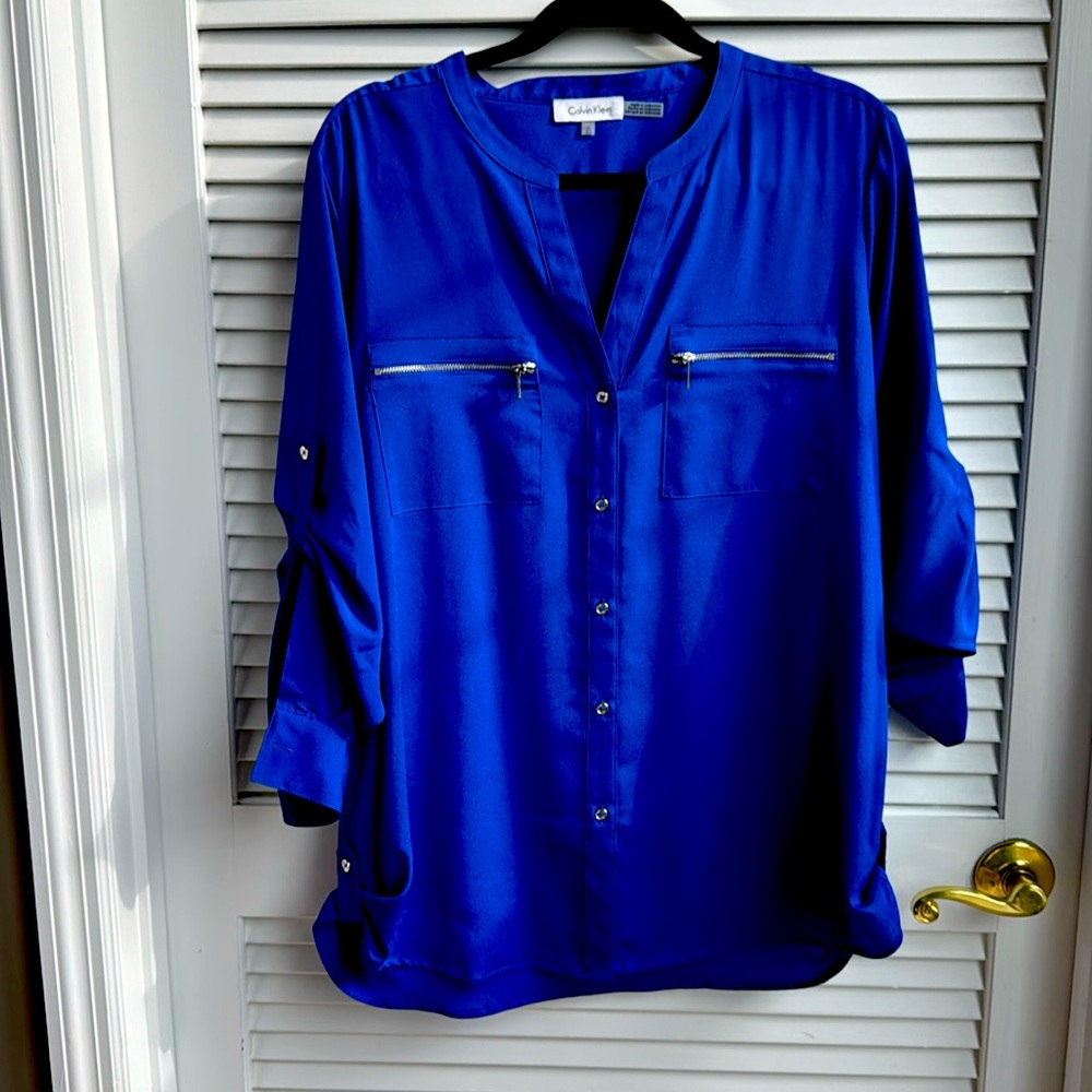Calvin Klein blouse with silver pocket zippers and detail at hips and arms
